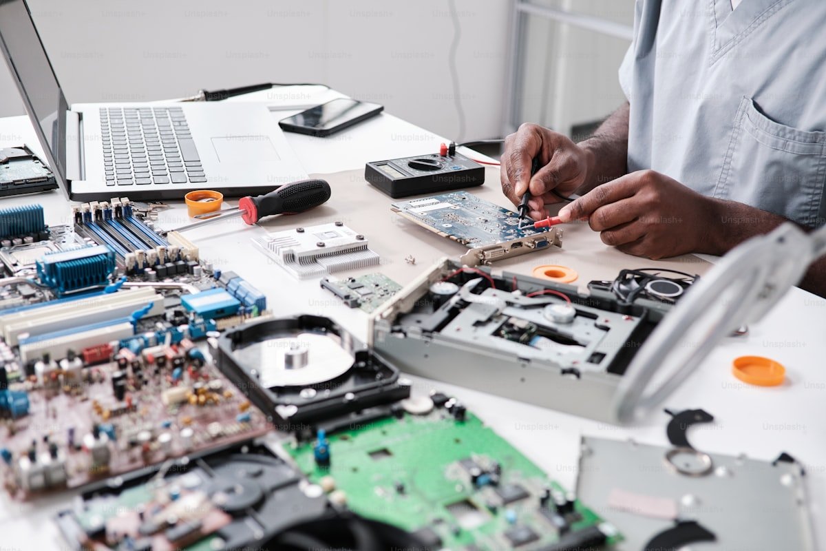 Close-up of circuit board repair work