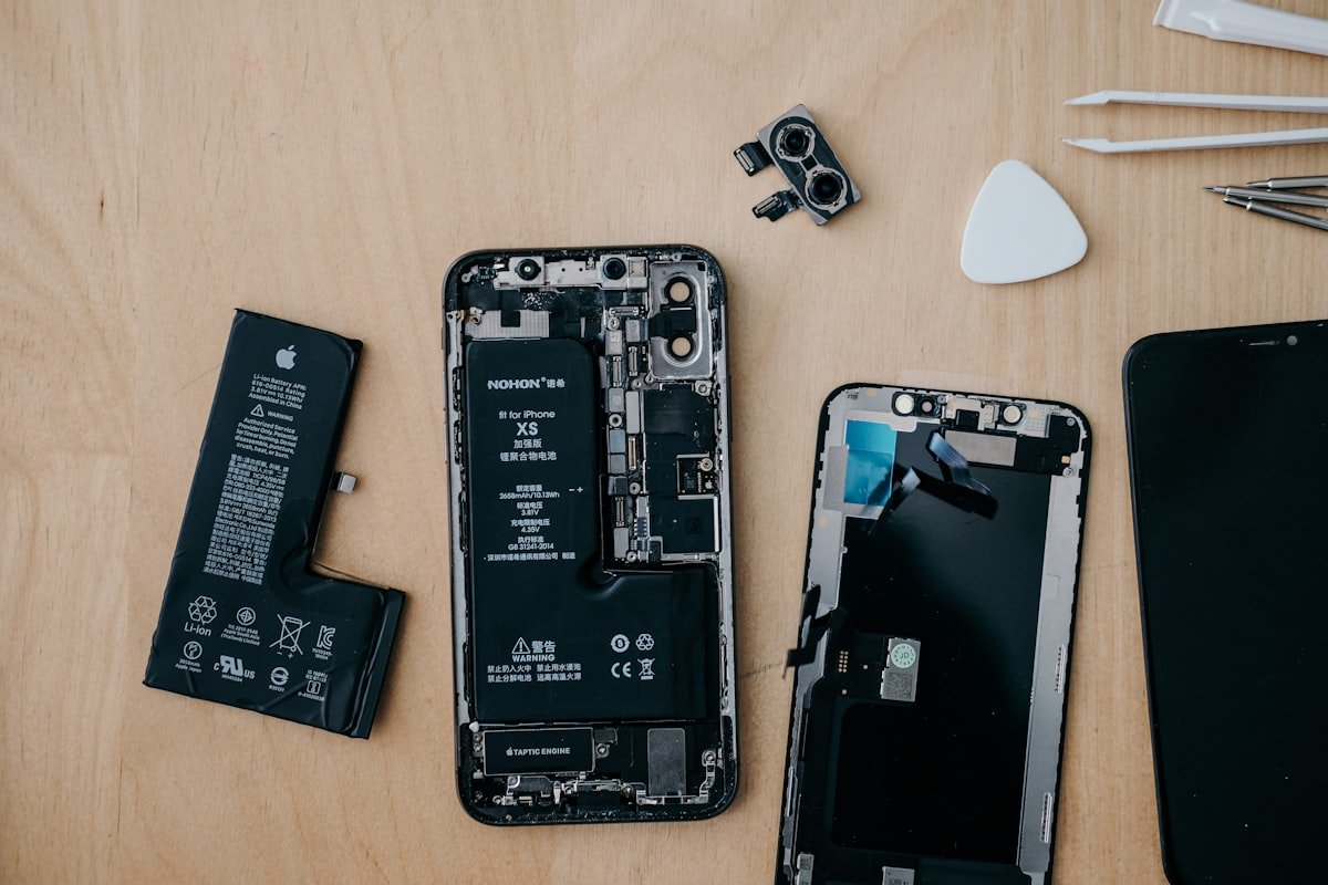 Close-up of a smartphone motherboard repair in progress